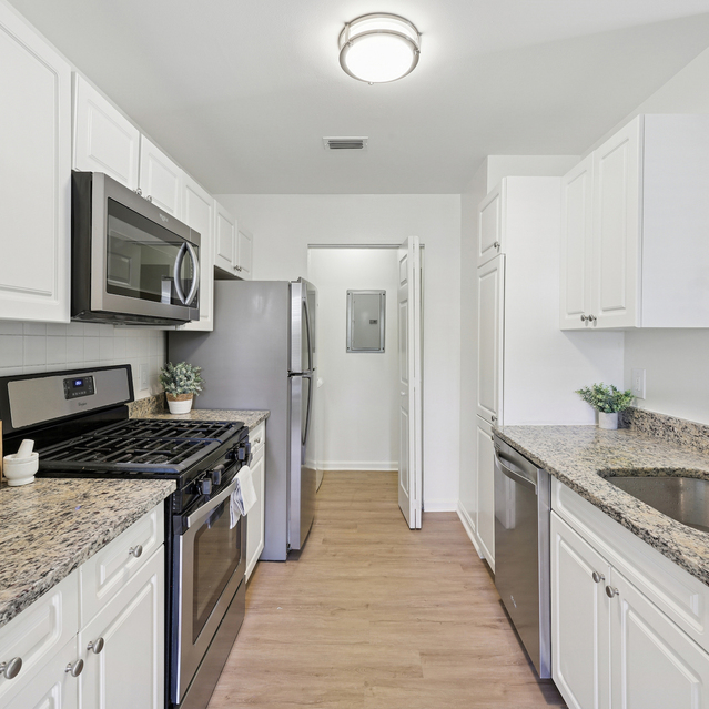 The Estates - Modern Kitchen With Granite Countertops