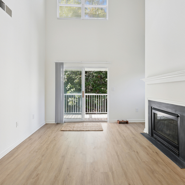 The Estates - Living Area With Fireplace And Sliding Doors