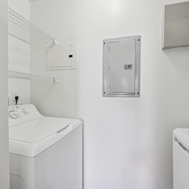 The Estates - Clean Laundry Area With Washer And Dryer