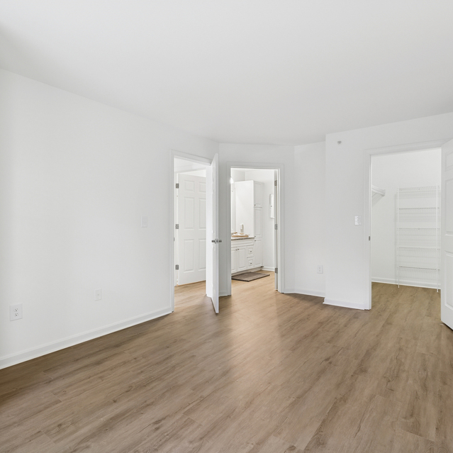 The Estates - Spacious Bedroom With Wood Floors And Closet