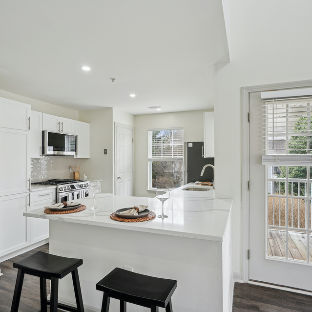 The Estates - Bright Open Kitchen With Breakfast Bar