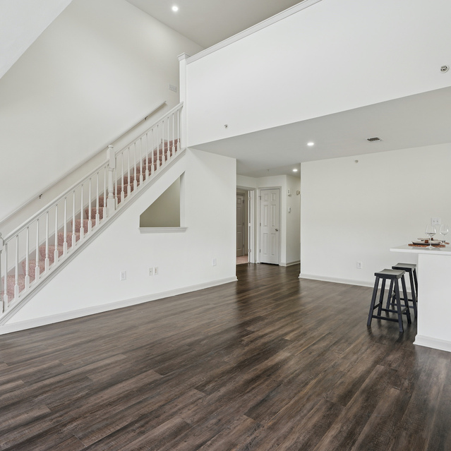 The Estates - Open Living Space With Staircase And Kitchen