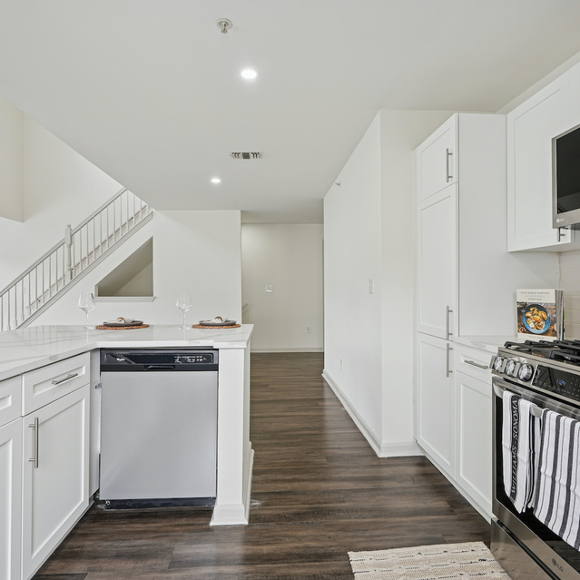 The Estates - Modern Kitchen With Stainless Steel Appliances
