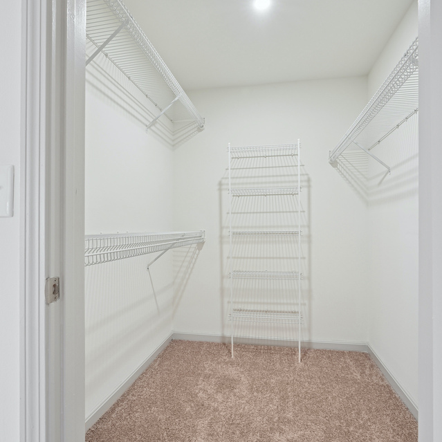 The Estates - Walk In Closet With Built In Shelving