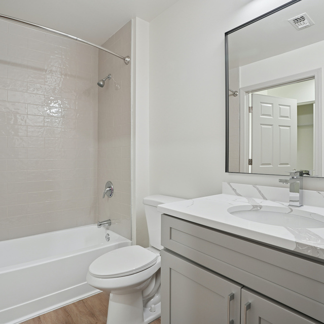 The Estates - Clean Bathroom With Tub And Vanity
